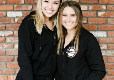 Two women, gym team members