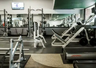 Gym with fitness equipment and tv