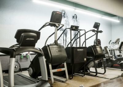 Fitness Equipment grouped together inside of gym